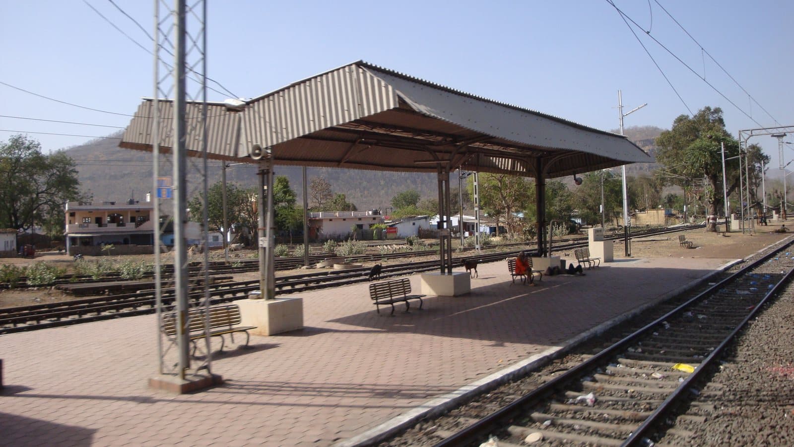 The platform of Budni railway station in Madhya Pradesh, with hills behind
